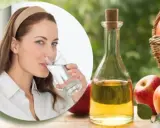 Mujer bebe agua, junto a botella de vinagre de manzana y manzanas. Una rutina saludable para tomar vinagre de manzana en ayunas.